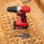 The Avid Power 20V cordless drill kit displayed on a clean workshop workbench.