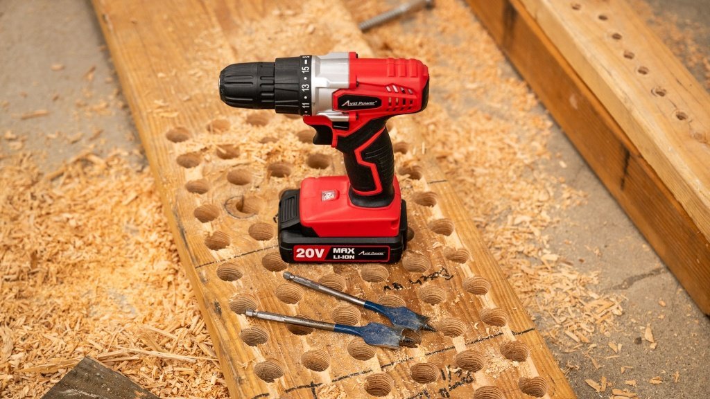 The Avid Power 20V cordless drill kit displayed on a clean workshop workbench.